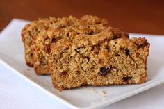 two pieces of granola sitting on top of a white plate