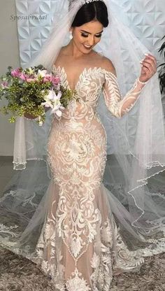 a woman in a wedding dress holding a bouquet