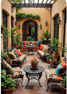 an outdoor patio with lots of seating and potted plants