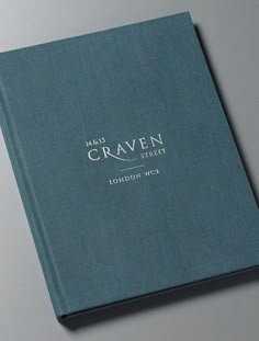 a blue book with the words craven on it