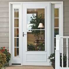 a white front door with a lamp on it