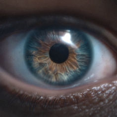 the iris of an eye is seen in this close up photo