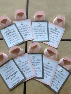 some pink ribbon and cards with words on them