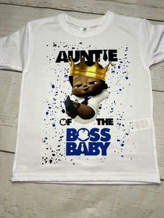 a white t - shirt with an image of the boss baby wearing a gold crown