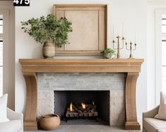 a living room filled with furniture and a fire place next to a fireplace covered in candles