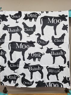 a black and white cow pattern on a table cloth