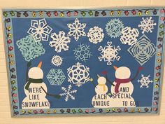 a bulletin board decorated with snowflakes and saying we're like snowflakes