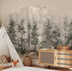 a teepee tent in front of a forest wall mural