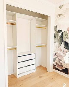 an empty closet with floral wallpaper on the walls