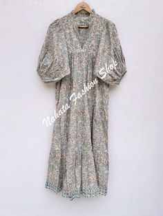 ITEM DESCRIPTION brown green floral women's long maxi dress- V neckline printed cotton dress -  with elastic sleeves Features: 3/4th sleeve, V neck, Long dress Fabric : 100% Cotton Cambric hand block print fabrics  Sleeve Length = 22 inch For more sizes & their measurement, please refer our below chart to understand the sizes variations available with us For your size requirement, please mention your size in seller note at the time of buying. SIZE MEASUREMENT  BUSTLENGTHSHOULDER XXS34 inch51 inch13.5 inch XS36 inch51 inch14 inch S38 inch51 inch14.5 inch M40 inch51 inch15 inch L42 inch51 inch16 inch XL44 inch51 inch16.5 inch 2XL46 inch51 inch17 inch 3XL48 inch51 inch18 inch   Company Return Policy:  Please write for more information to my email directly CHOOSE "ASK SELLER QUESTION" Payment Green V-neck Cotton Midi Dress, Green Cotton V-neck Maxi Dress, Green Boho Dress With Floral Print And V-neck, Green V-neck Cotton Maxi Dress, Printed Cotton Maxi Dress With V-neck, Printed Cotton V-neck Boho Dress, V Neck Long Dress, Elastic Sleeves, Hand Embroidery Videos