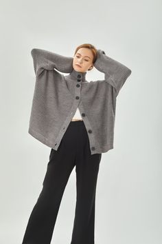 A high ribbed funnel neck, relaxed silhouette and a wonderfully versatile smoky mid-grey hue mean this grey cardigan will slot seamlessly into your wardrobe. Wool spinning, large buttons and a neat plain placket complete this modern interpretation of a classic piece. Our model is 175cm. Wearing size M. The promotional item is not refundable. 21CT002 Turtleneck With Cardigan, Wool Spinning, Knitwear Inspiration, Grey Turtleneck, Womens Turtleneck, Versatile Outfits, Button Cardigan, Large Buttons, Grey Cardigan