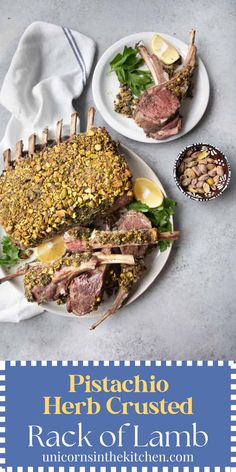 two plates with meat and vegetables on them, next to a bowl of lemons