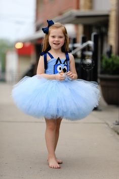 Tutu dress features a bodice embellished with Bluey's face, handmade from felt and glitter foam. Skirt is made of 4 layers of premium quality made in the USA tulle that's hand tied onto bodice. Dress skirt is designed to sit at natural waist. Dress features handmade felt tail and Bluey's spots. Bluey And Bingo Costume, Fruit Party Theme, Natural Waist Dress, Fiesta Bluey, Birthday Party Photos, Floppy Bunny, Costume Tutu, Book Character Costumes, Bluey And Bingo