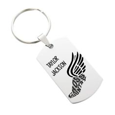 a white keychain with the words tacos jackson on it