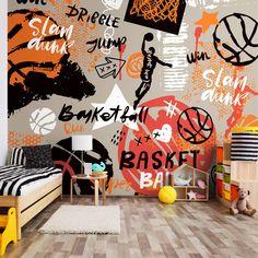 a child's bedroom with basketball themed wallpaper