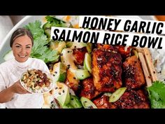 a woman holding a plate of food with the words honey garlic salmon rice bowl