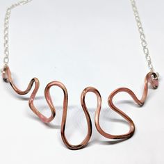 This Handcrafted Necklace Is Predominantly A Muted Pink -- Similar To Ballet Pink. Made From Thick Wire Which Was Enameled With Multiple Layers Of Translucent Lead Free Vitreous Enamel. The Wire Has Been Attached To A Sterling Silver Chain With A Lobster Clasp. The Curve Of The Wire Makes The Necklace Best Worn High On The Neck As A Choker. The Necklace Is About 17" Long, But Can Be Worn Shorter. One Of A Kind And Brand New Without Tags. Handmade Rose Gold Enamel Jewelry, Copper Chain Jewelry Gift, Unique Sterling Silver Rose Gold Necklace, Unique Rose Gold Pendant Necklace, Unique Rose Gold Sterling Silver Necklace, Gold Enamel Jewelry With Soldered Details, Silver Chain Jewelry With Copper Material, Handmade Artisan Rose Gold Necklace, Handmade Copper Chain Necklace Gift