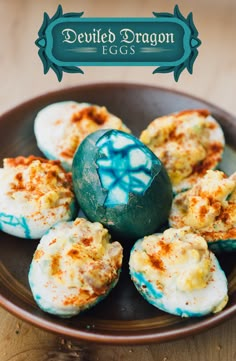 some kind of food that is in a bowl on a table with a blue and white egg