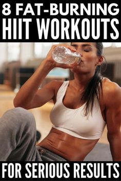 a woman drinking water while sitting on the floor