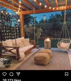 an outdoor living area with swings and lights