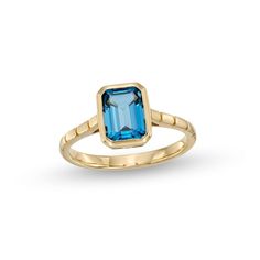 Embrace the easy sophistication of this emerald-cut London blue topaz solitaire ring. 10K gold. The 8.0 x 6.0mm emerald-cut London blue topaz solitaire glistens in a polished frame. Ribbed shank adds texture and interest to the look. Gemstone Engagement Rings, The 8, 10k Gold, Blue Stone, Solitaire Ring, Emerald Cut, Blue Topaz