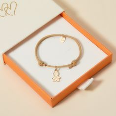 Celebrate your little one with our Children’s Personalized Mini Boy Bracelet. A special keepsake for them to treasure, each bracelet can be personalized to capture your little one’s unique character. Choose between a choice of vibrant braid colours to pair alongside a mini boy charm, hand engraved with their name.18K Champagne Gold Plated, 925 Sterling Silver or 18K Rose Gold PlatedMini Boy:0.47 x 0.31Braid made of a durable, colourfast polyesterFully adjustable sliding knot fasteningHand-engraved in our Paris workshopSent with love in a complimentary gift boxAny slight variations in lettering depth, spacing and alignment from the examples shown are part of the aesthetic and originality of the pieceChildren’s Warning: please note, this piece of jewelry is not a toy. We advise you to not le Adjustable Name Bracelet With Charms For Birthday, Cute Charm Bracelet With Removable Charms As Gift, Customizable Adjustable Charms For Gifts, Customizable Adjustable Charms, Adjustable Customizable Charms For Gifts, Personalized Bracelet Charms For Gifts, Adjustable Charm Bracelets For Birthday, Nickel-free Adjustable Charms For Birthday, Nickel-free Adjustable Birthday Charms