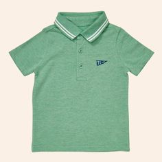 The Andre polo shirt is comfortable enough to play in all day but can also be worn for perhaps one of life’s dressier moments - think school picture day or brunch with grandma. The Andre polo shirt is made from our super soft pique knit and features a classic rib collar and cute embroidery at the chest. 93% Organic Cotton, 2% Recycled Polyester, 5% Spandex Classic Green Collared T-shirt, Classic Polo Shirt With Polo Collar For School, Classic Polo Shirt For School, Classic School Polo Shirt, Preppy Polo Shirt With Polo Collar For Summer, Classic Cotton Polo Shirt For School, Preppy Summer Polo Shirt With Polo Collar, Green Collared Cotton Polo Shirt, Casual Short Sleeve Polo Shirt For School