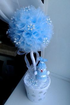 a baby blue bouquet on top of a cake