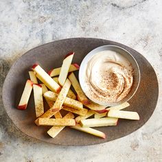 a plate with apples, cinnamon and whipped cream