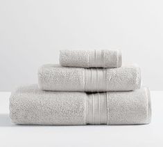 three white towels stacked on top of each other