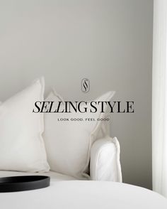 a bed with white sheets and pillows in a room that has the words selling style on it