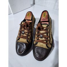 This Authentic Gucci Leather And Monogram Canvas Lace Up Sneakers Brown/Beige Size 7.5 Is In It’s Good Pre-Owned Condition. The Exterior Canvas Is Clean. The Dark Brown Leather At The Front Of The Shoe Shows Some Sign Of Scratches To It. Interior Is Clean. Kindly Look At Pictures Above. Size: 7.5 Designer Brown Wingtip Sneakers, Gucci Leather Sneakers With Laces, Vintage Brown Sneakers With Laces, Vintage Leather Sole Slip-on Sneakers, Vintage Slip-on Sneakers With Leather Sole, Designer Brown Slip-on Sneakers, Brown Almond Toe Sneakers With Rubber Sole, Gucci Leather Slip-on Sneakers, Vintage Leather Sneakers With Laces