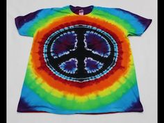 a tie dye shirt with a peace sign on it