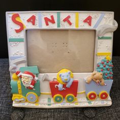 an old fashioned photo frame with santa and his train