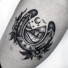 a black and white image of a crescent with stars on it's side thigh