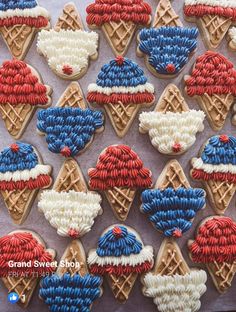 decorated cookies with red, white and blue icing in the shape of waffles