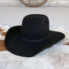 Introducing the Resistol Hooey Day Money cowboy hat, crafted with durable 4X Wool Felt for rugged authenticity. From the Hooey Collection, it features a striking 5 1/4" Bullrider Crown and a classic 90 Profile, embodying the spirit of the West. Complete with a distinctive Hooey Hatpin and a 4 1/4" Brim, it's your go-to for rodeos, ranching, and everyday adventures on the range. 4 1/4" Brim 5 1/4" Bullrider Crown Color: Black 4X Wool Black Flat Bill Hat For Ranch, Western Flat Bill Hat For Rodeo, Western Style Flat Bill Hat For Rodeo, Black Flat Bill Hats For Country Events, Western Style Top Hat For Rodeo With Flat Bill, Western Flat Bill Top Hat For Rodeo, Western Style Flat Bill Top Hat For Rodeo, Cowboy Hat Black, Felt Cowboy Hat