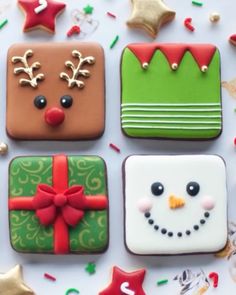 decorated christmas cookies on a table with confetti and sprinkles