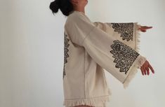 Immerse yourself in the bohemian spirit with this exquisite Boho Mandala Fringed Kimono Cardigan. This unique piece features intricate mandala embroidery, meticulously handmade to add a touch of ethnic elegance to your wardrobe. Perfect for festivals, casual outings, or relaxing at home, this kimono cardigan is designed to provide both style and comfort. Crafted from high-quality, lightweight fabric, this cardigan features detailed mandala patterns on the back and sleeves, complemented by fringe Festival Long Sleeve Kimono With Fringe, Bohemian Fringe Cardigan For Festivals, Long Sleeve Festival Kimono With Fringe, Bohemian Cotton Outerwear With Tassels, Long Sleeve Fringe Kimono For Festivals, Spring Fringed Long Sleeve Kimono, Bohemian Spring Cardigan With Tassels, Spring Fringe Long Sleeve Kimono, Spring Long Sleeve Fringed Kimono