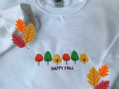 🍂 It's never too early to shop for some cozy sweatshirts for the Fall Season!🍂 🍁 Enjoy FREE SHIPPING for the season!  🍁 Our Happy Fall sweatshirts comes in 6 different colors but if you would like another color reach out to me and we can try to make that happen!  🍁 If you would like to purchase multiple sweatshirts please contact me first!    Sizing : These sweatshirts are in ADULT sizes. Sizes differ between each manufacturer so we strongly recommend using the measurement chart provided in White Hoodie With Embroidered Graphics For Fall, White Hoodie With Custom Embroidery For Fall, White Hoodie With Embroidered Text For Fall, White Embroidered Hoodie For Fall, White Embroidered Sweatshirt For Fall, Women's Sweatshirts, Colorful Gifts, Round Neck Sweatshirts, Fall Sweatshirt