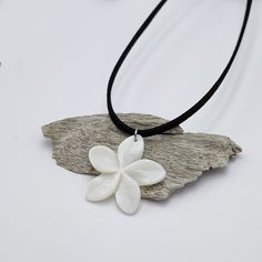 Handmade necklace with a layer of faux suede and a white shell flower pendant. The high-grade stainless steel beads, chain and findings are hypoallergenic, durable, and won't tarnish. Flower size: around 34mm x 35mm The high-grade stainless steel chain, beads and findings are hypoallergenic, durable, and won't tarnish. 2 options of length: * 38cm + 7cm of an extender chain. Total length is 45cm. * 48cm + 7cm of an extender chain. Total length is 55cm. If you want a different length please leave Hawaiian Flower Necklace, Surf Necklace, Hawaiian Flower, Beads Chain, Hawaiian Flowers, Handmade Necklace, Flower Pendant, White Flower, Flower Necklace