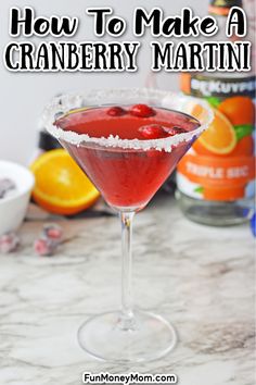 a cranberry martini is garnished with powdered sugar