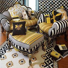 a living room with black and white striped furniture