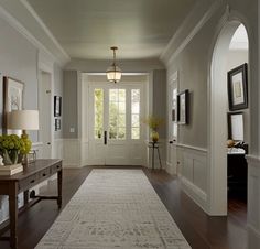 the hallway is clean and ready for us to use as an entrance way in this home