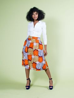 Orange African Skirt | Ankara Midi Skirt | Orange | Sale Fitted Orange Cotton Skirt, Orange Fitted Cotton Skirt, Orange Lined Skirt For Workwear, Orange Workwear Skirt With Lining, Fitted Orange Midi Skirt, Orange Skirt For Workwear In Summer, Chic Orange Knee-length Skirt, Chic Knee-length Orange Skirt, Orange Pleated Midi Skirt