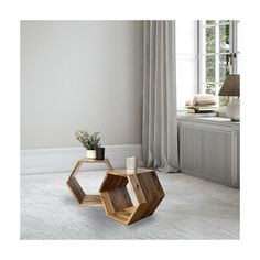 a wooden coffee table sitting on top of a carpeted floor next to a window