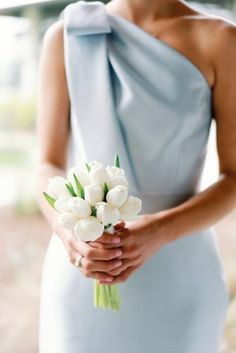 Posey bouquet of white tulips. Small Wedding Bouquet Simple White, Small White Tulip Bouquet, Bridesmaid Bouquet Blue Dress, Bridesmaid Lily Bouquet, Blue And White Bridesmaids Bouquet, Petite Bridesmaid Bouquet, Bridesmaid Posey, White Tulip Bouquet Wedding, Modern Bridesmaid Bouquet