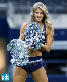 a cheerleader is posing for the camera