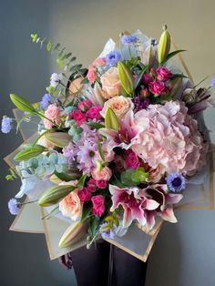 a bouquet of flowers in a black vase