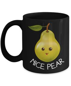 a black coffee mug with an image of a smiling pear on it's side